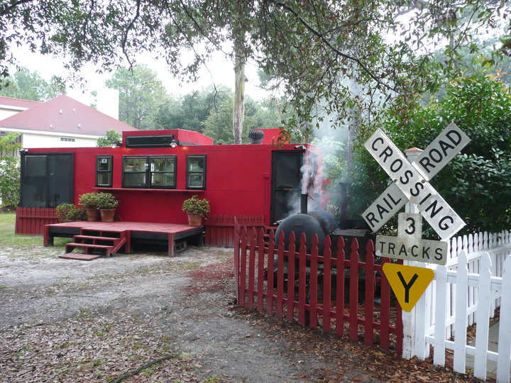 The red caboose exterior at Choo-Choo BBQ